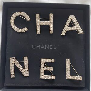 CHANEL Gold/Crystal Letter Brooch Set